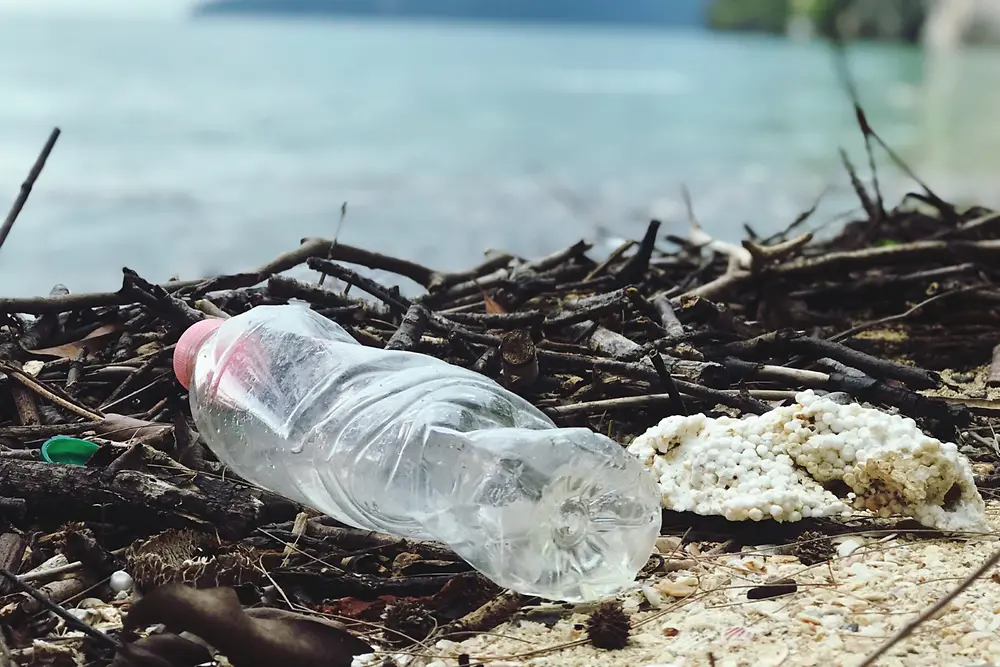 Discarded plastic bottle on the beach