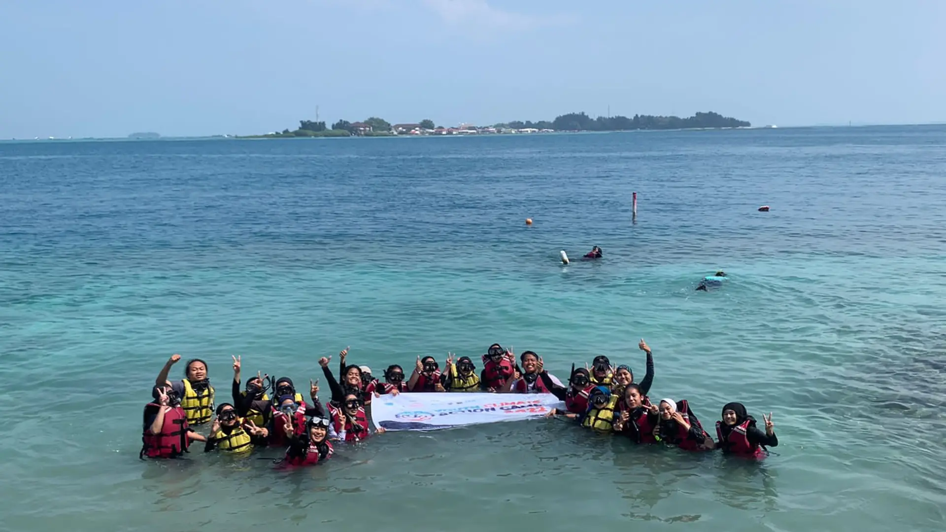 Group photo in the ocean.