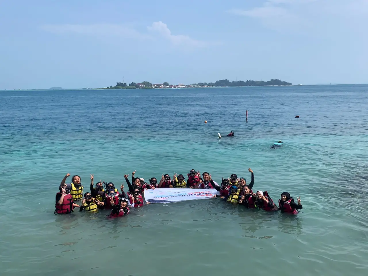 Group photo in the ocean.