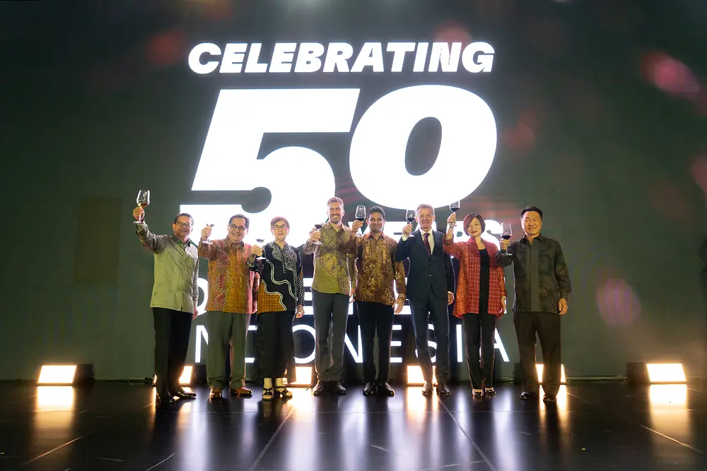 A group of people standing on a stage.