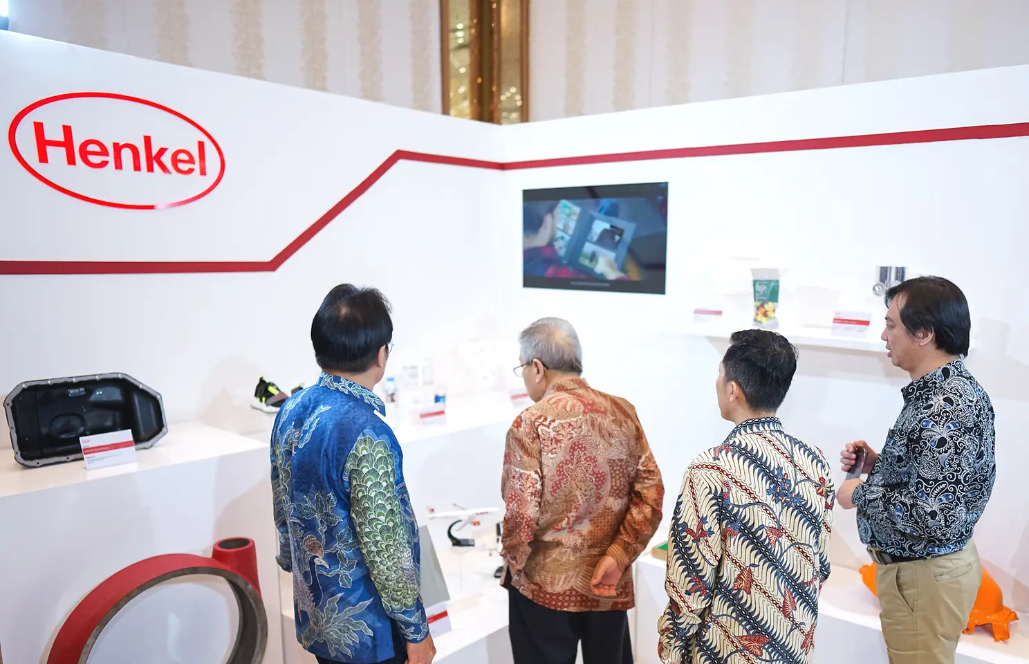 A group of people looking at a display.